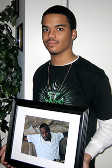 Darius Cooke with photo of Keith Jamar Truesdale