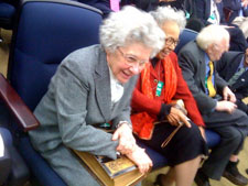 Elizabeth Huebner holds the Bible on which her son, David Huebner, would be sworn in as Ambassador to New Zealand and Samoa. To her left is Dora McWaine, mother of Ambassador Huebner’s spouse, Duane McWaine; and longtime LGBT activist Frank Kameny. 