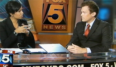 Andrew Barnett (left) of SMYAL speaking on Fox 5
