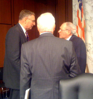 Gen. John J. Sheehan (Ret.), left, speaks with Senate Armed Services Committee Chairman Carl Levin (D-Mich.), right, following a committee hearing on Thursday, March 18, about the ''Don't Ask, Don't Tell'' policy.