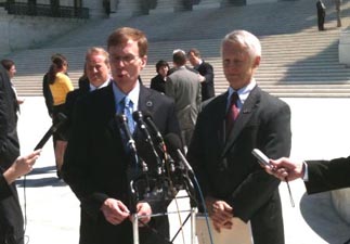 Washington Attorney General Rob McKenna (R), left, and Secretary of State Sam Reed (R) talk to reporters after the oral arguments were held at the U.S. Supreme Court in Doe #1 v. Reed.