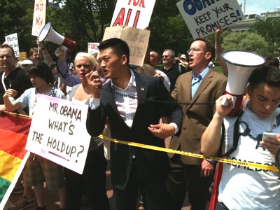 Lt. Daniel Choi speaks at May 2 Get Equal rally, with James Pietrangelo behind him
