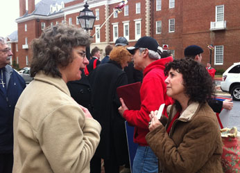 An opponent of the marriage bill (L) argues with a supporter outside Maryland State House
