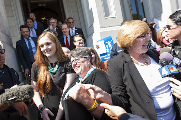Photo: Plaintiffs Mary Townley (right), Carol Schall and their daughter Emily. Credit: AFER.