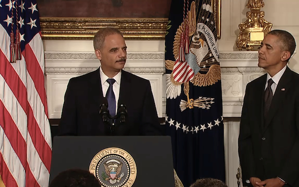Image: Eric Holder announces his resignation.