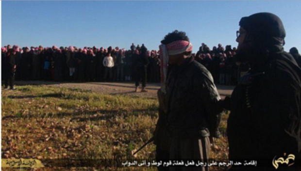 A large crowd watched as the man was led into the field.