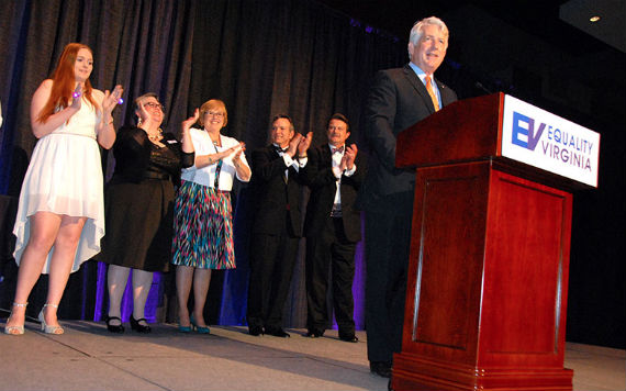 Va. Attorney General Mark Herring addresses Equality Virginia's 12th Annual Commonwealth Dinner (April 2015), surrounded by the lead plaintiffs in the cases that helped overturn Virginia's ban on same-sex marriage.