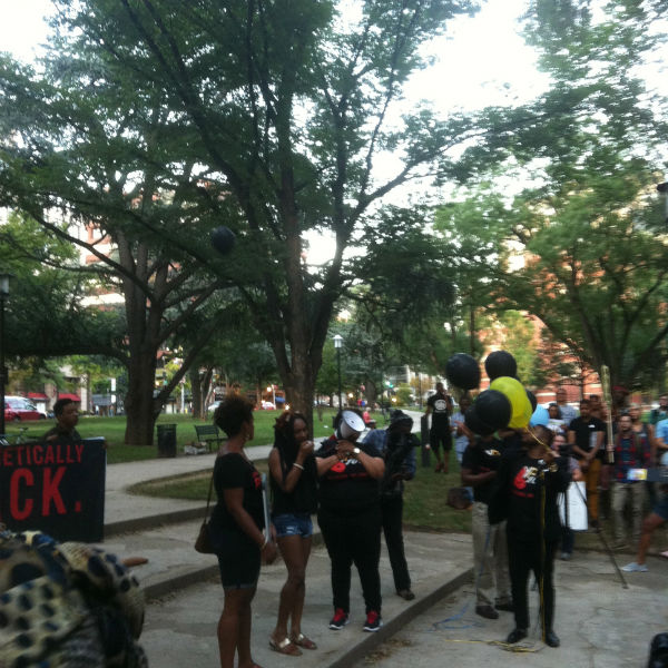 Organizers release balloons to commemorate the lives of transgender women of color lost to violence at BLM's Trans Liberation Tuesday rally (Credit: John Riley).