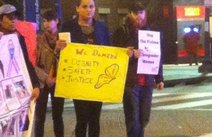 Demonstrators holding signs block the street at the Trans Day of Action demonstration. The demonstration was to call attention to anti-trans violence, police brutality and mistreatment of transgender women, and to call for the end of detention and deportation of transgender immigrants.  John Riley