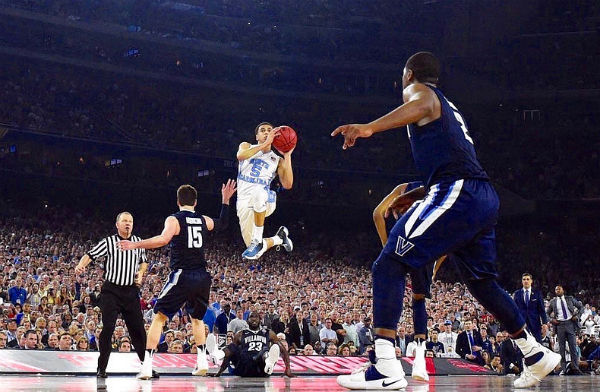 University of North Carolina's Marcus Paige shoots a 3-pointer durinng the 2016 NCAA Championship Game against Villanova - Photo: James W. Neal, via Wikimedia.