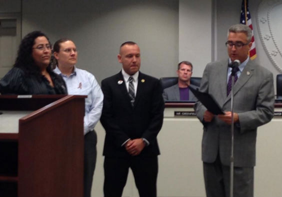 Fairfax City Mayor Scott Silverthorne reads aloud a proclamation he will present to members of Northern VA Pride recognizing June as LGBT Pride Month (Photo: Northern VA Pride, via Facebook).