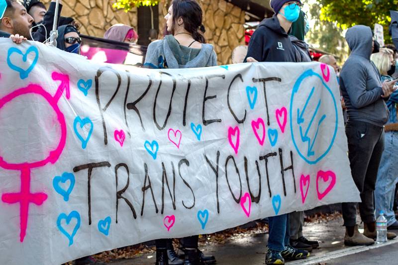 https://www.metroweekly.com/wp-content/uploads/2023/06/Protect-Trans-Youth-by-David-Geitgey-Sierralupe-Flickr.jpg