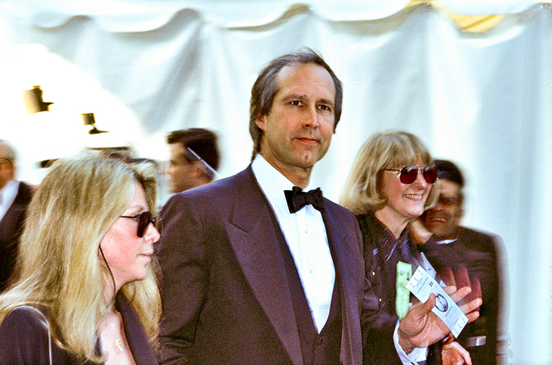 Chevy Chase on the red carpet at the 62nd Annual Academy Awards in 1990 - Photo: Alan Light via Flickr, CC BY 2.0